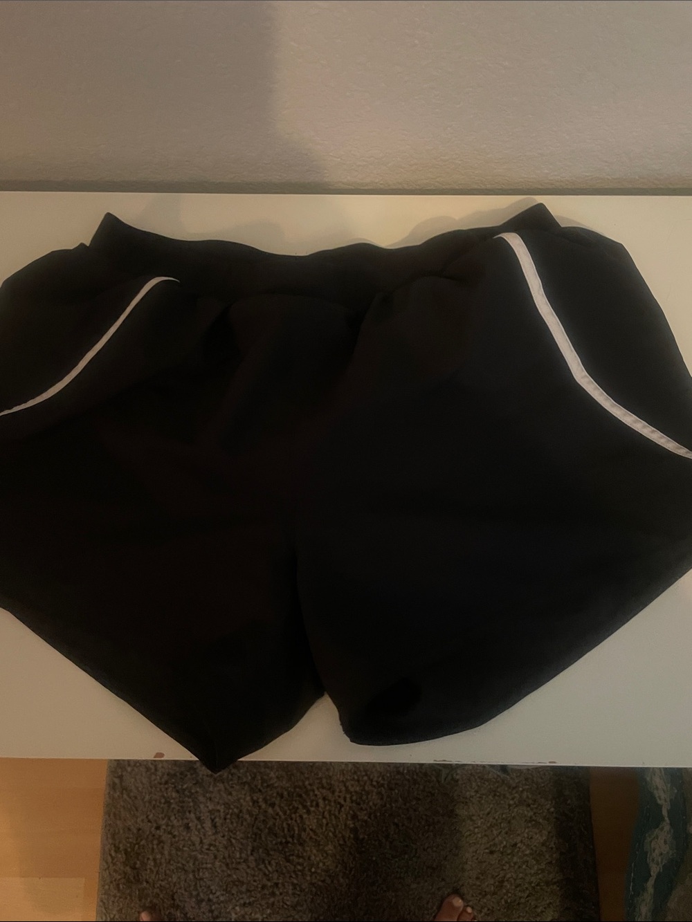 Women’s Under Armour Black Athletic Shorts with White Piping women’s size Med